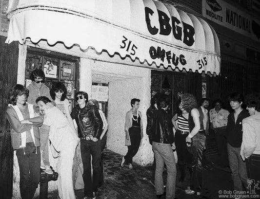 David Johansen, Danny Fields, Earl McGrath, Joey Ramone of the Ramones, Arturo Vega and friends outside of CBGB's, NYC, 1977 by Bob Gruen