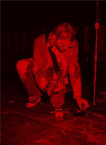 Kurt Cobain, Kneeling Red, 1993 by Jesse Frohman