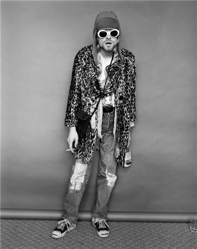 Kurt Cobain standing with Evian bottle, 1993 by Jesse Frohman