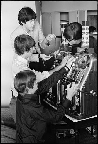 The Beatles with slot machine, 1964 by Curt Gunther